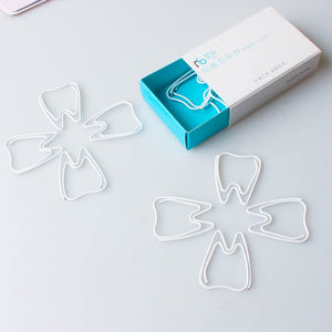 White teeth paper clips